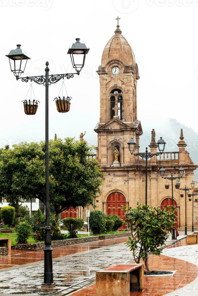 Beautiful central square and the San Jeronimo Parish Temple of the small town of Nobsa well known for the traditional handmade ruanas in the region of Boyaca in Colombia photo