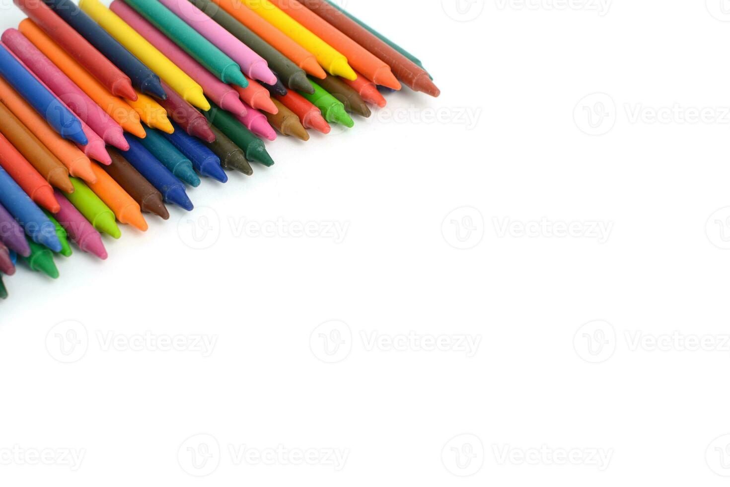 Crayons lined up isolated on white background. photo