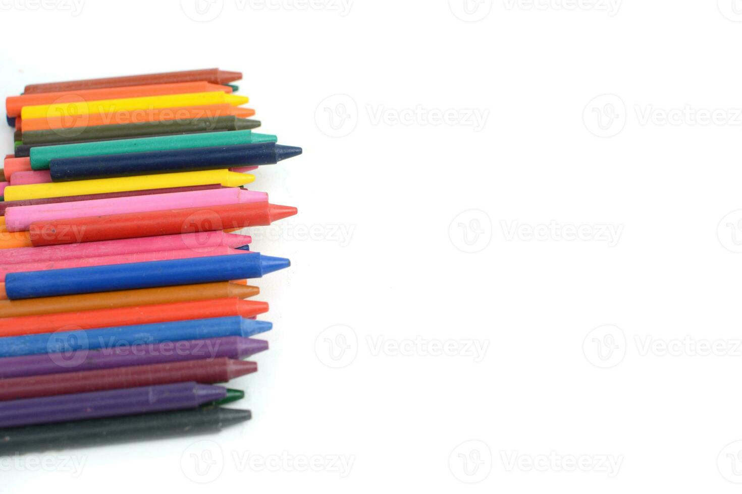 Crayons lined up isolated on white background. photo