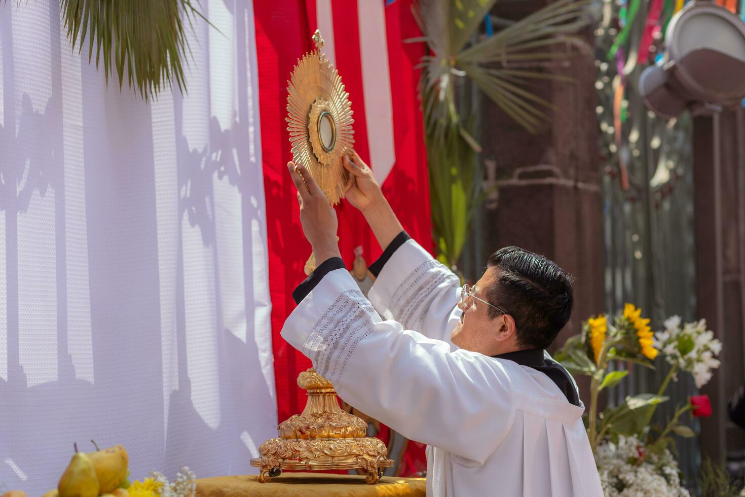 Puebla, Mexico 2023 - Priests and members of the catholic church in a time of worship. They worship Catholic Christian symbols photo