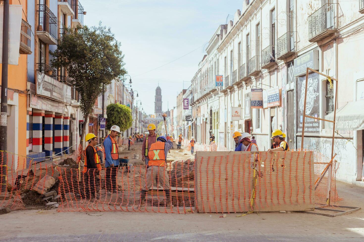 Puebla, Mexico 2023 - Construction workers work to repair a street in the Historic Center of Puebla photo