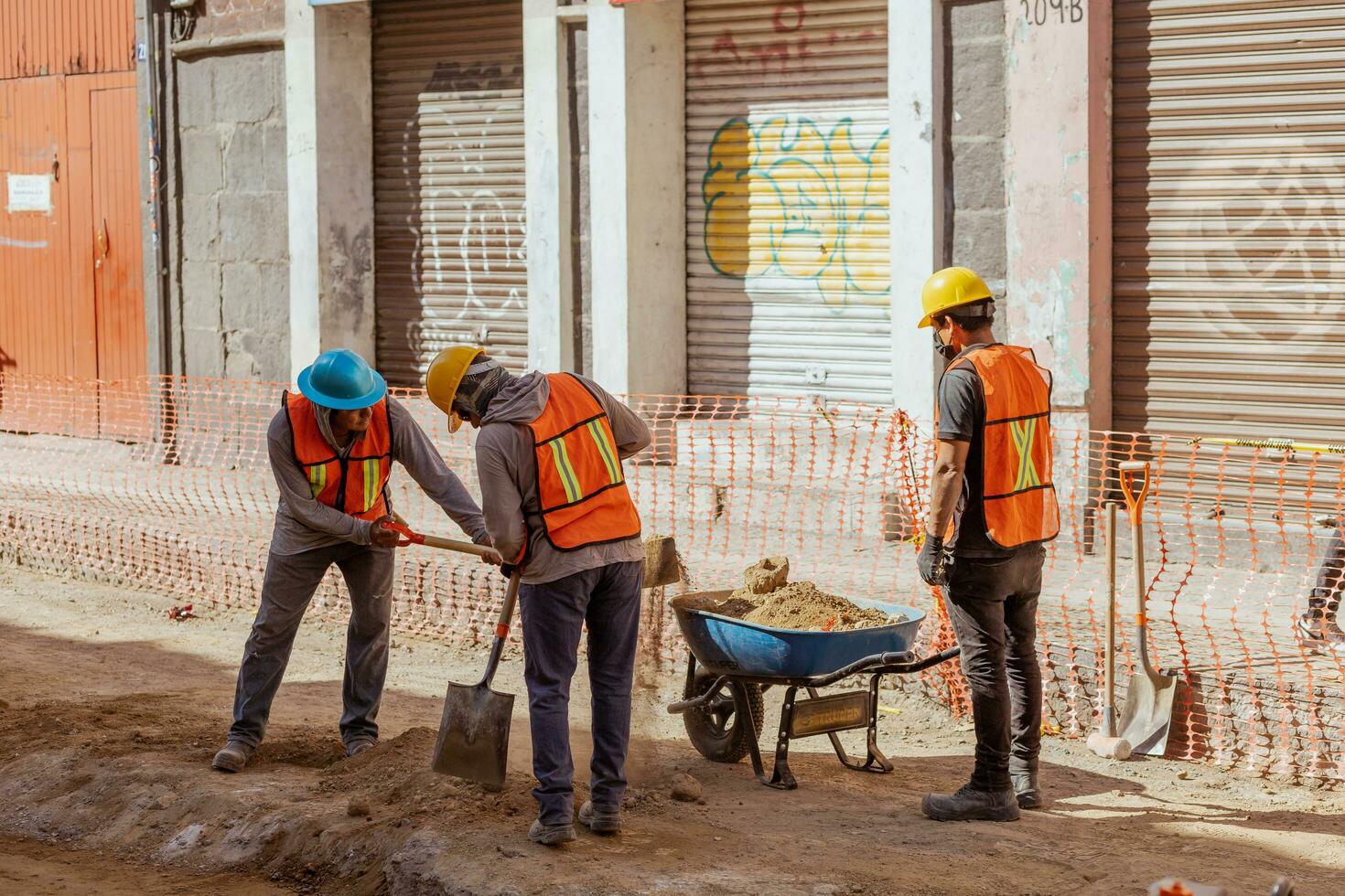 Puebla, Mexico 2023 - Construction workers work to repair a street in the Historic Center of Puebla photo