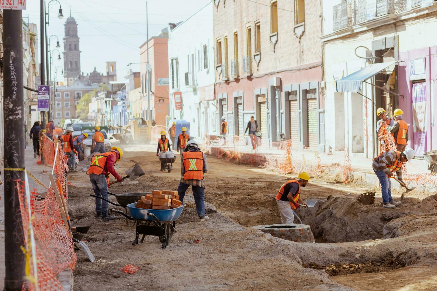 Puebla, Mexico 2023 - Construction workers work to repair a street in the Historic Center of Puebla photo