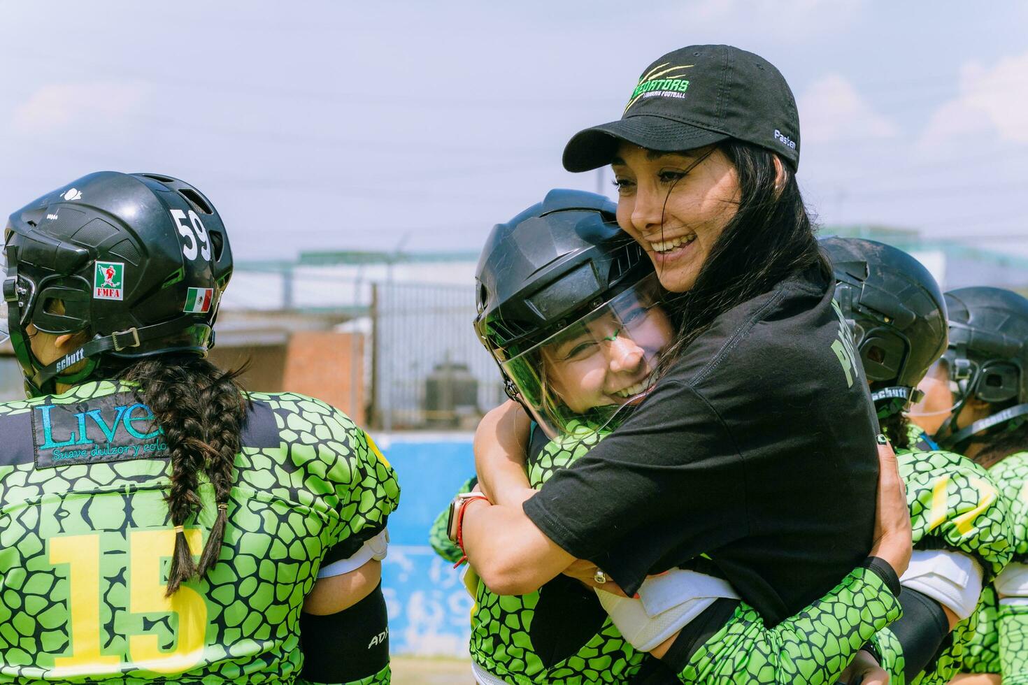 Puebla, Mexico 2023 - Mexican women football players celebrate victory with hug photo