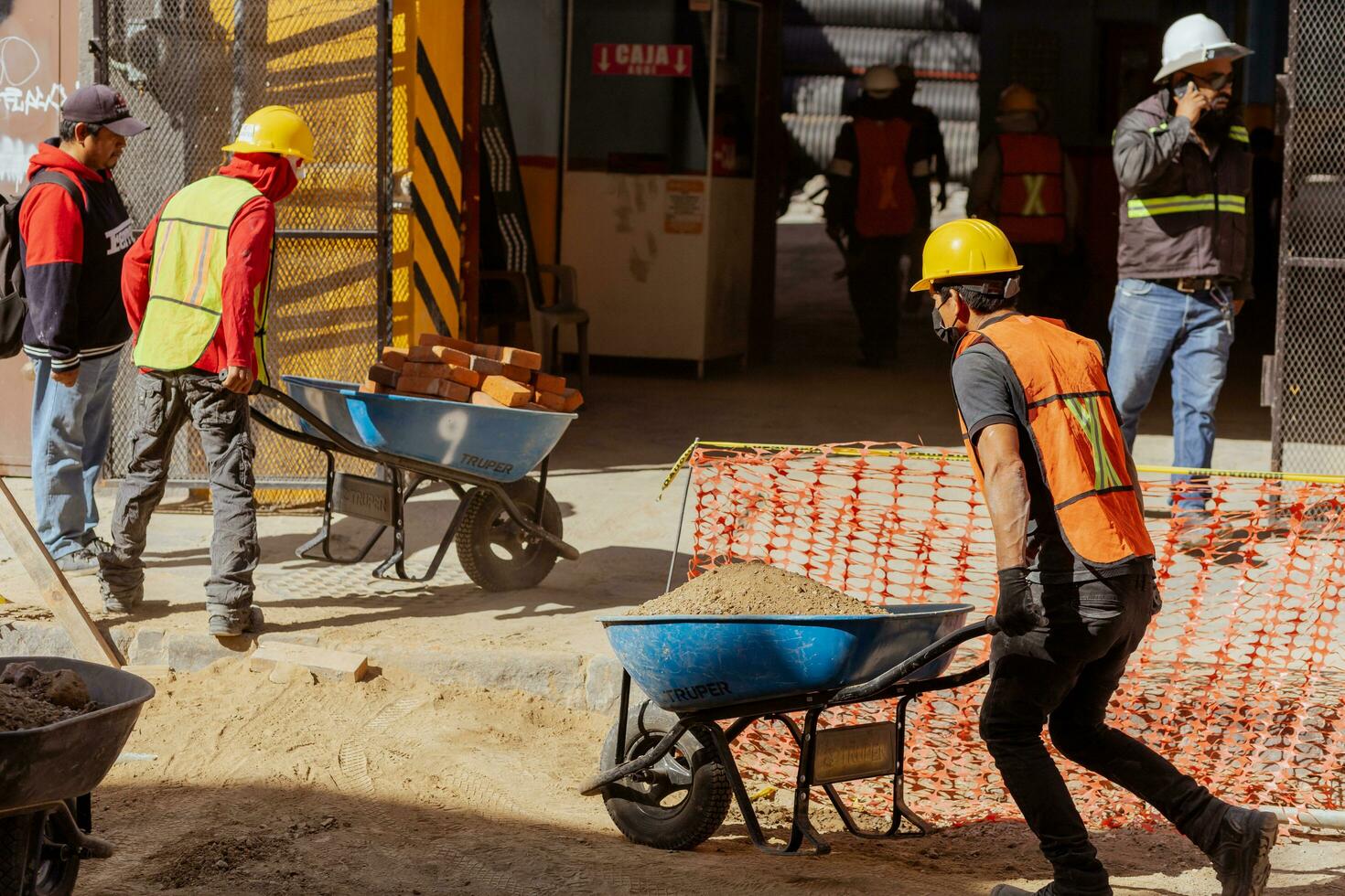 Puebla, Mexico 2023 - Construction workers work to repair a street in the Historic Center of Puebla photo