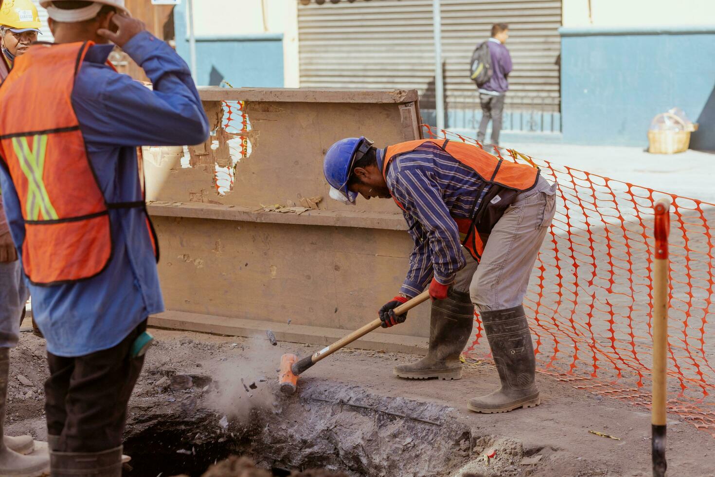 Puebla, Mexico 2023 - Construction workers work to repair a street in the Historic Center of Puebla photo