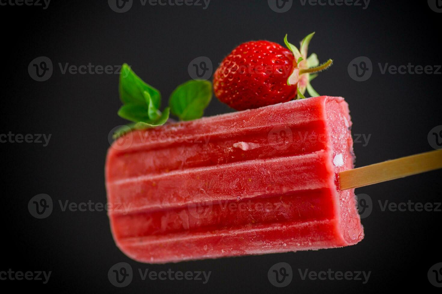 cooked homemade strawberry ice cream on a stick photo