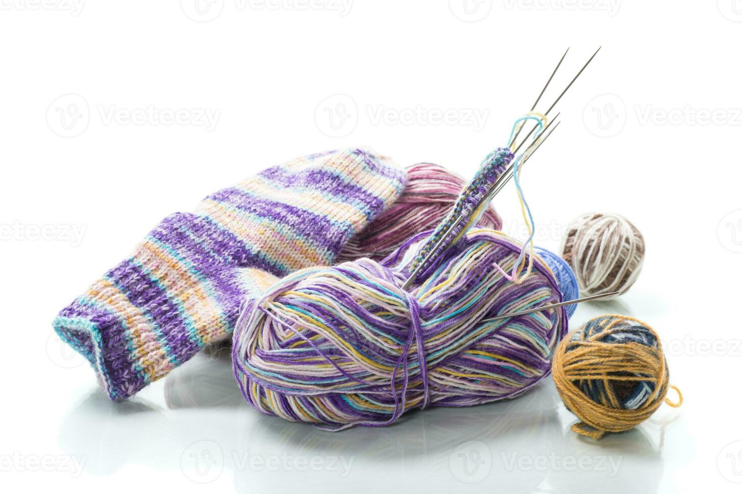 Colored threads, knitting needles and other items for hand knitting photo