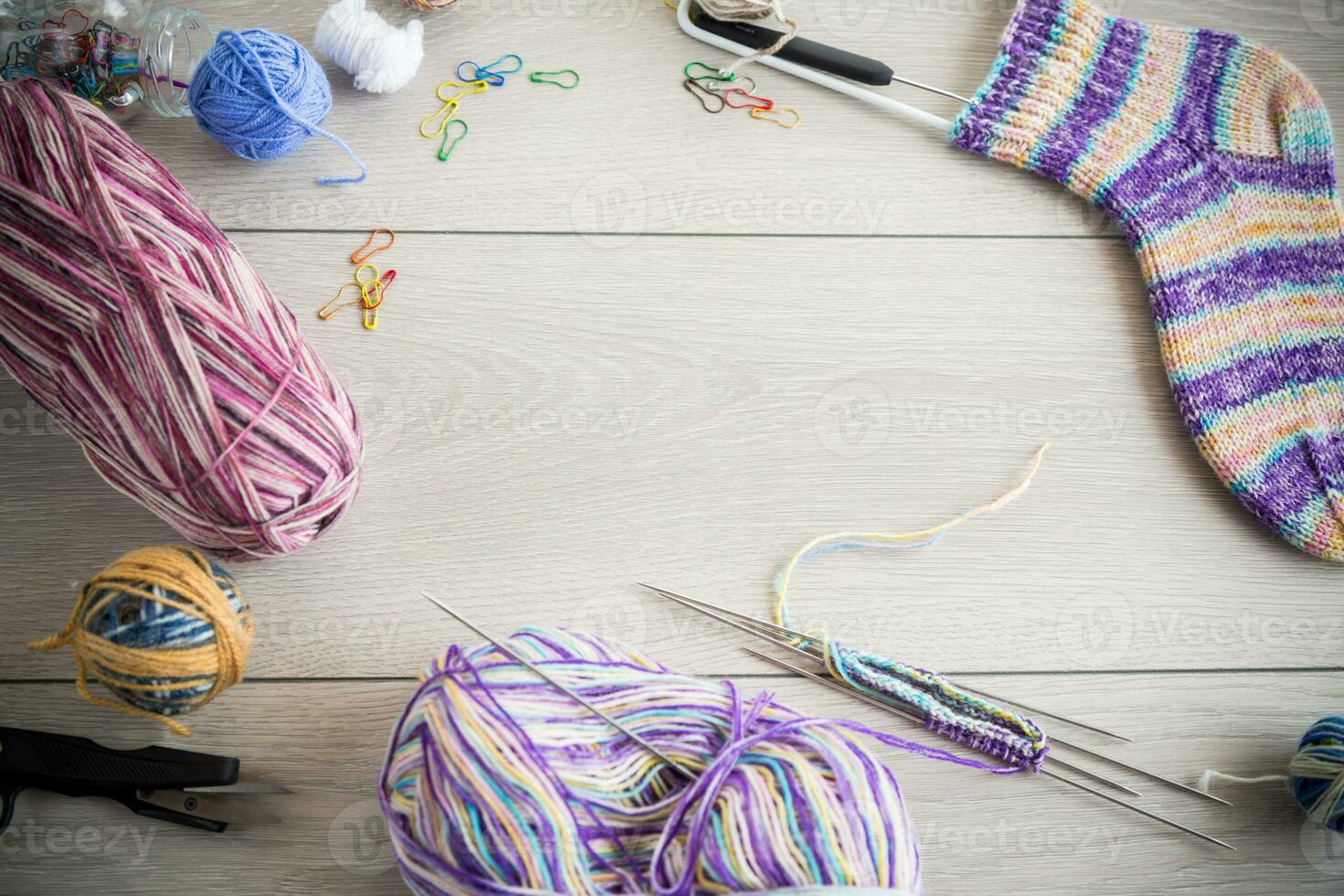 Colored threads, knitting needles and other items for hand knitting photo