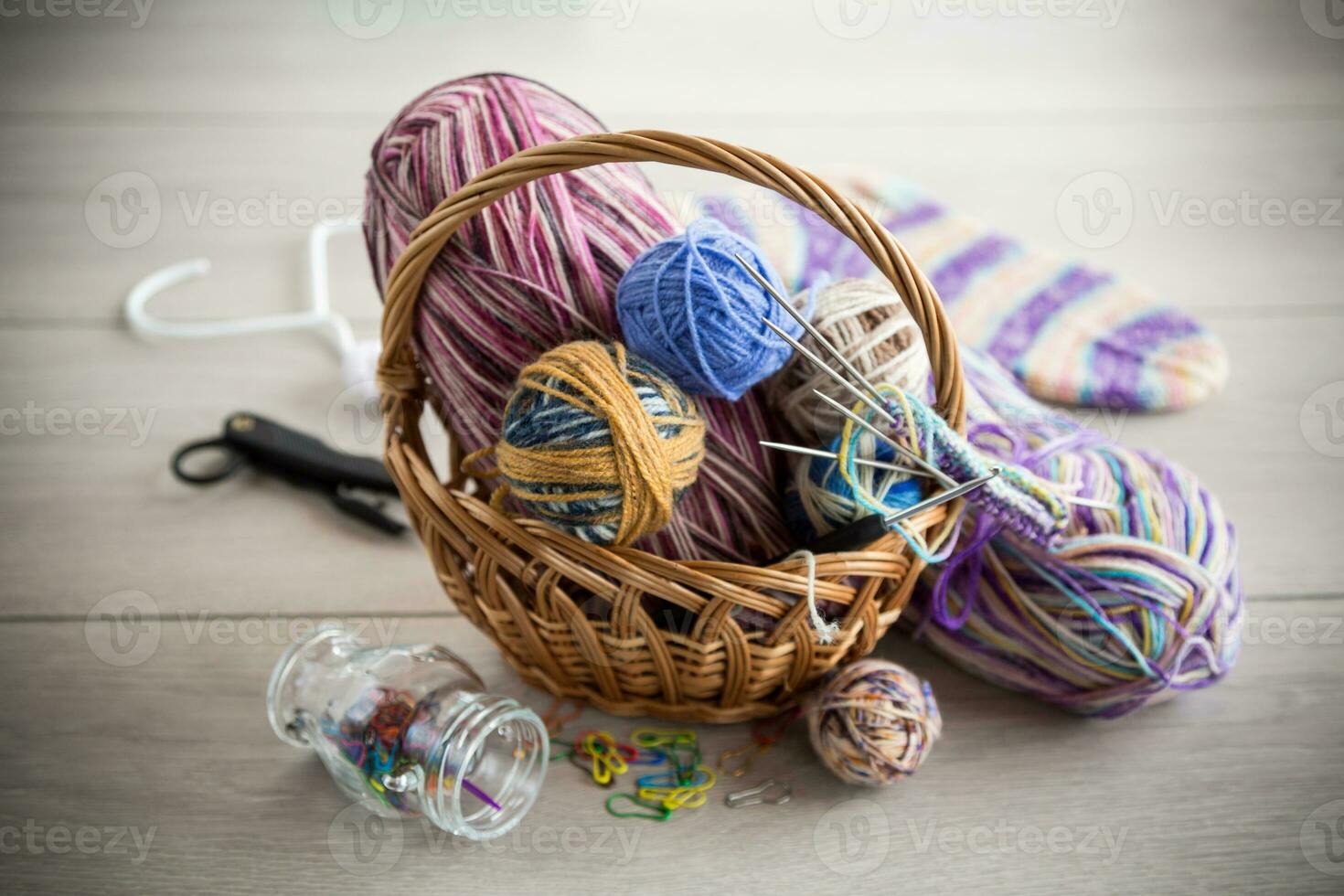 Colored threads, knitting needles and other items for hand knitting photo