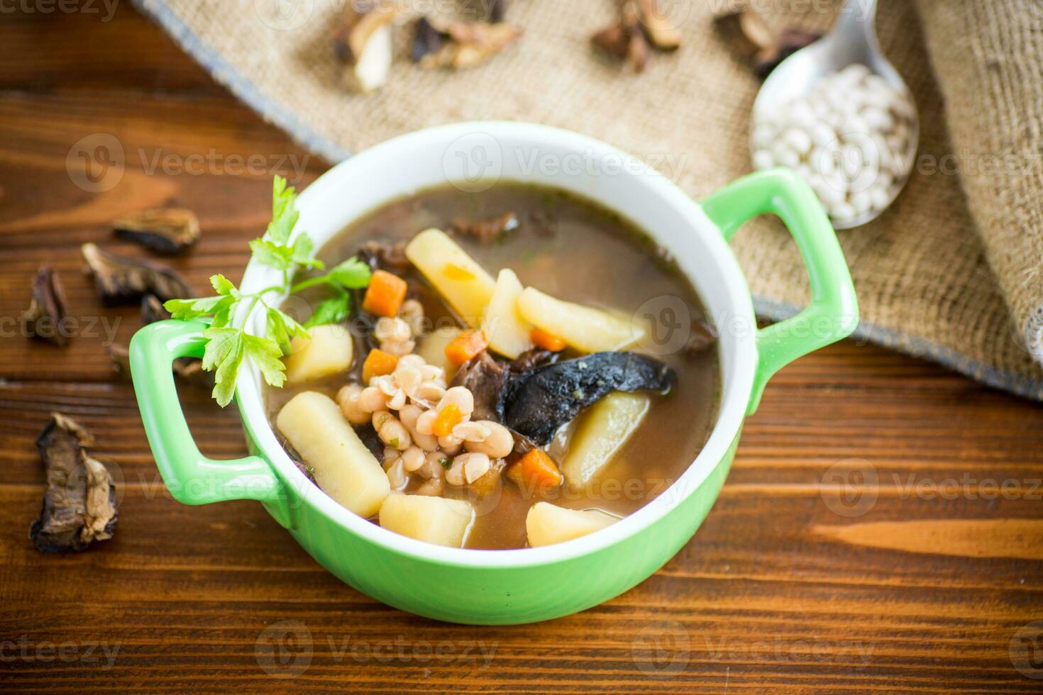 mushroom hot soup with beans in a bowl photo