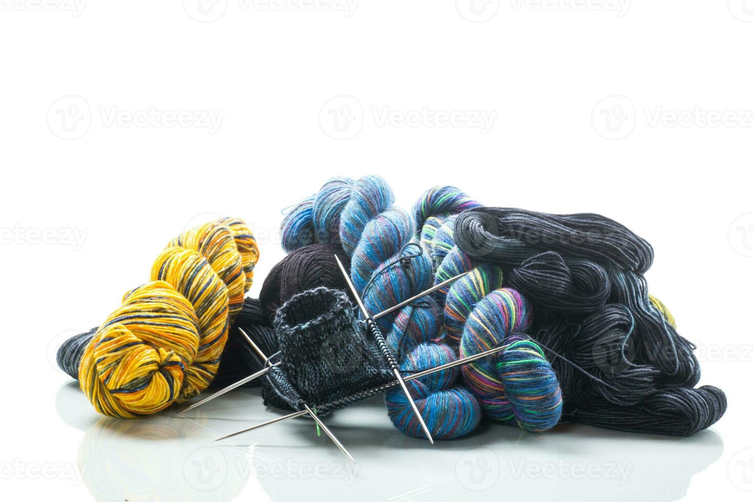 Colored threads, knitting needles and other items for hand knitting photo