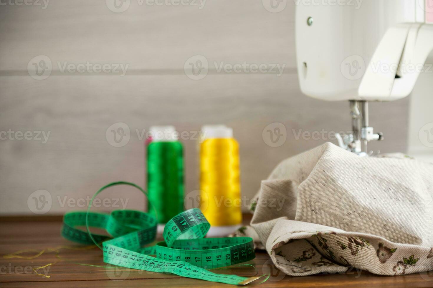 Sewing machine with fabric and threads for sewing, close-up. The working process photo