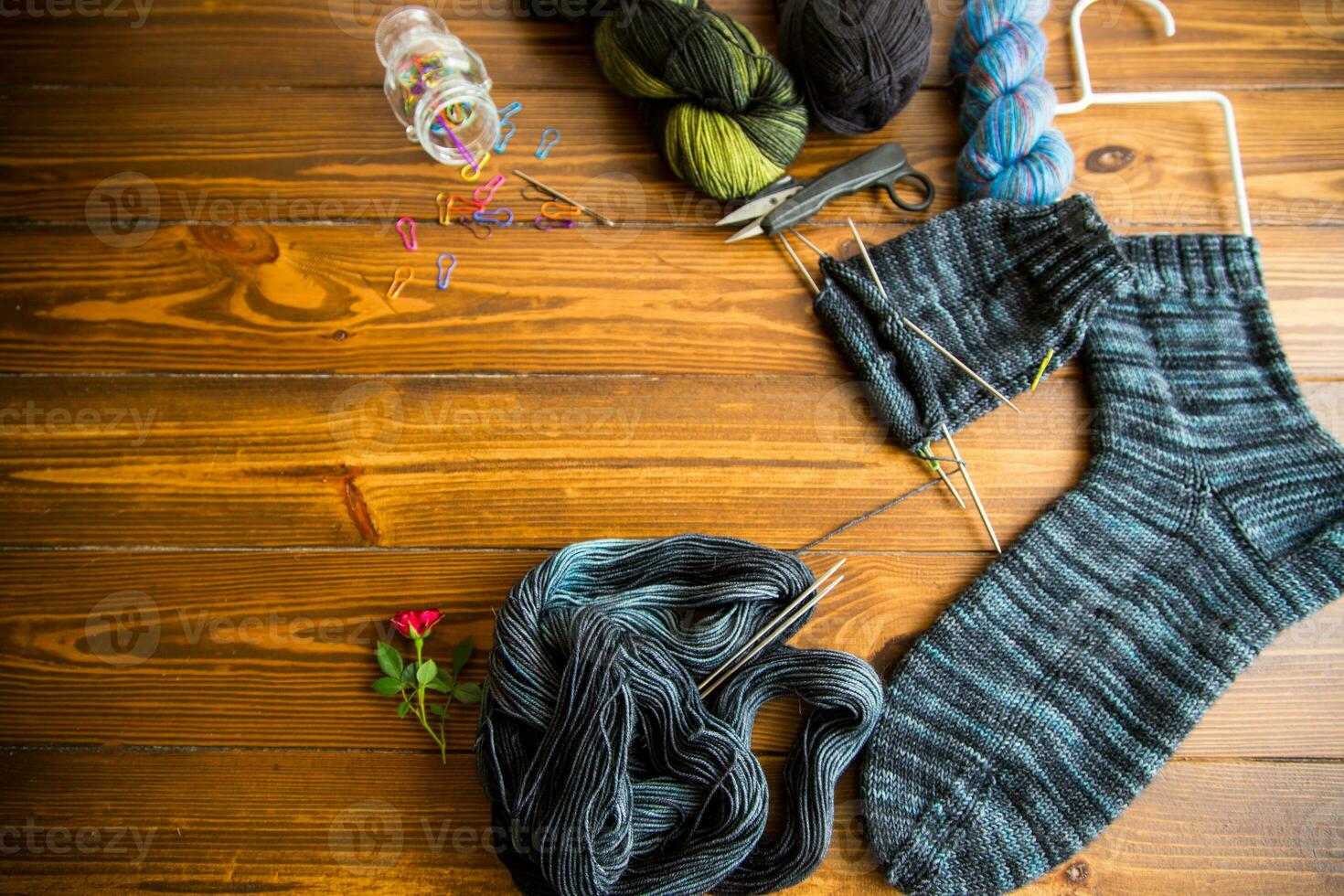 Set for hand knitting warm winter socks made of natural woolen yarn. photo