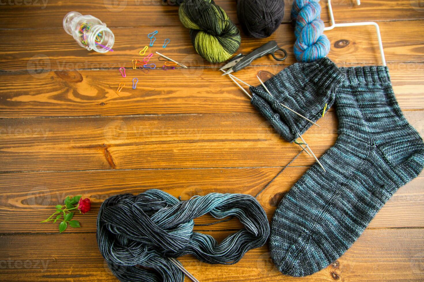 Set for hand knitting warm winter socks made of natural woolen yarn. photo