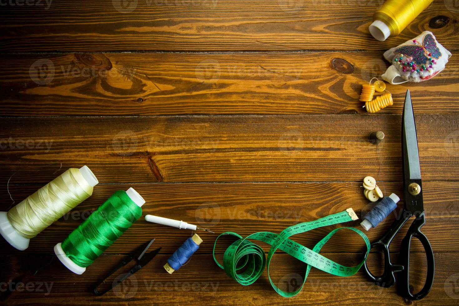 a set of tools and threads for sewing clothes photo