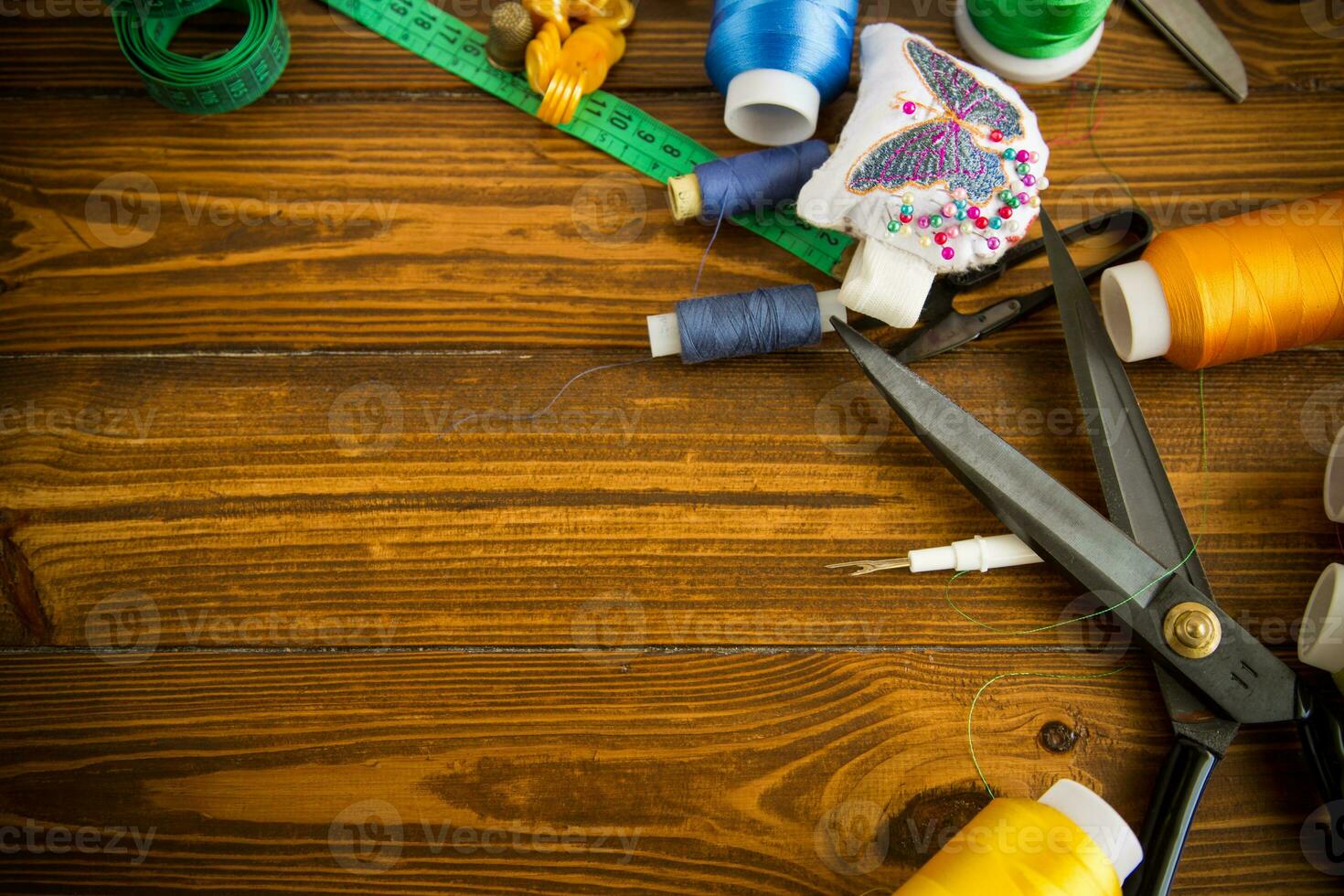 a set of tools and threads for sewing clothes photo