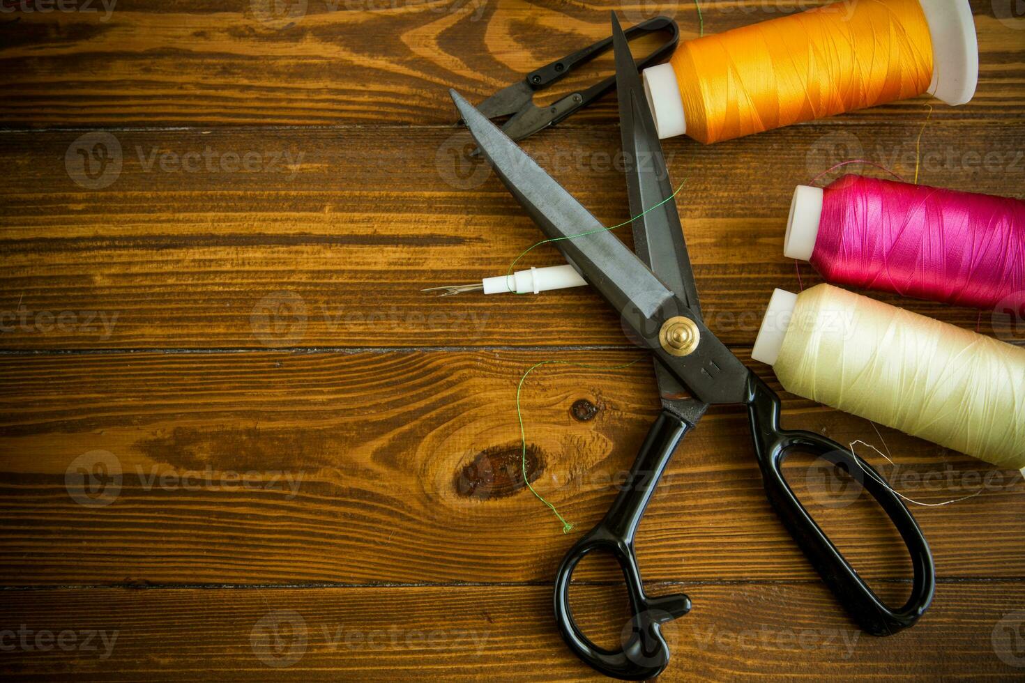 a set of tools and threads for sewing clothes photo
