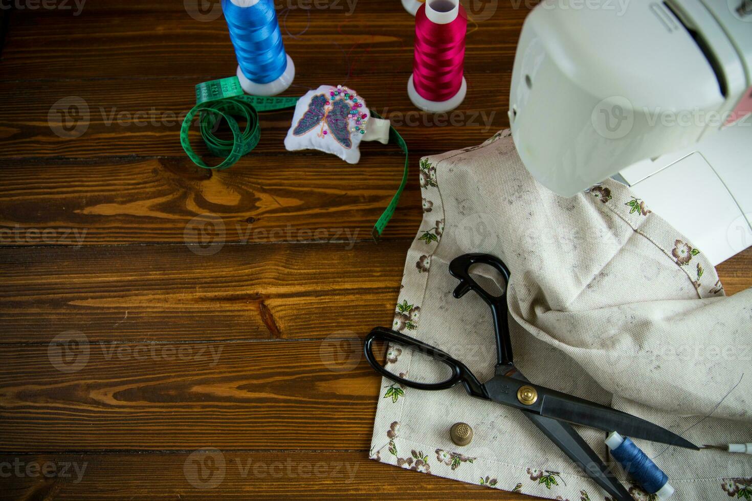 a set of tools and threads for sewing clothes photo