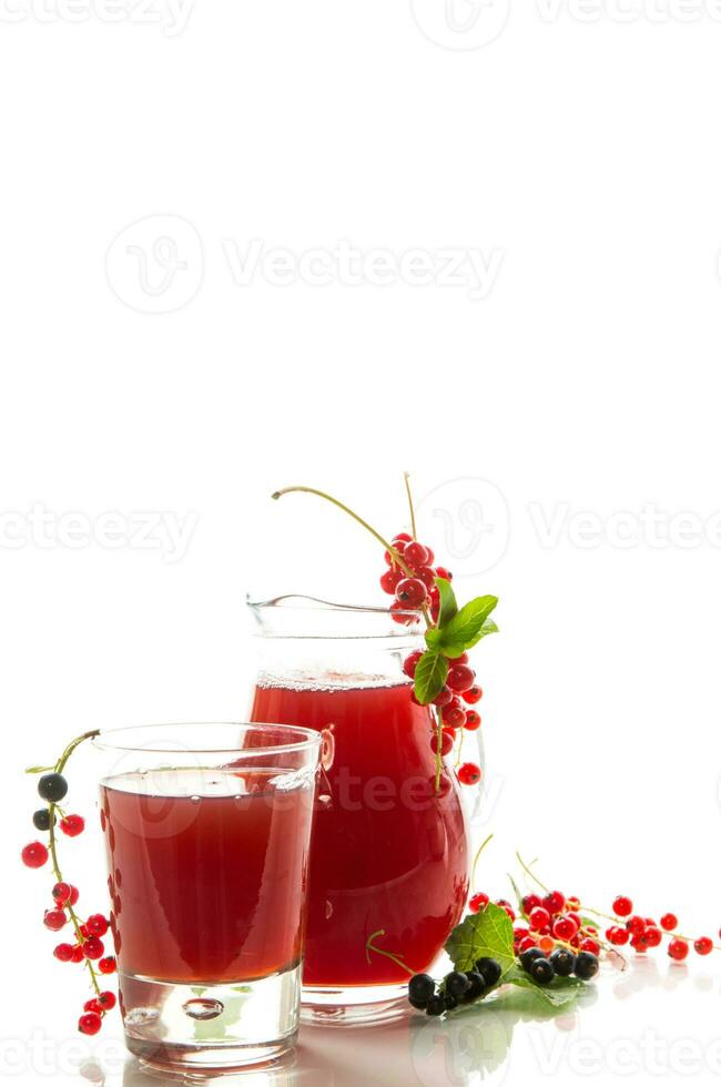 fresh berry juice from red and black currant, on white background photo