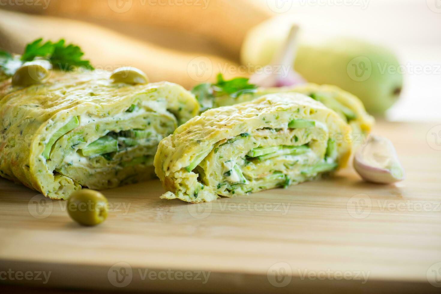 vegetable zucchini roll with garlic cheese filling inside. photo