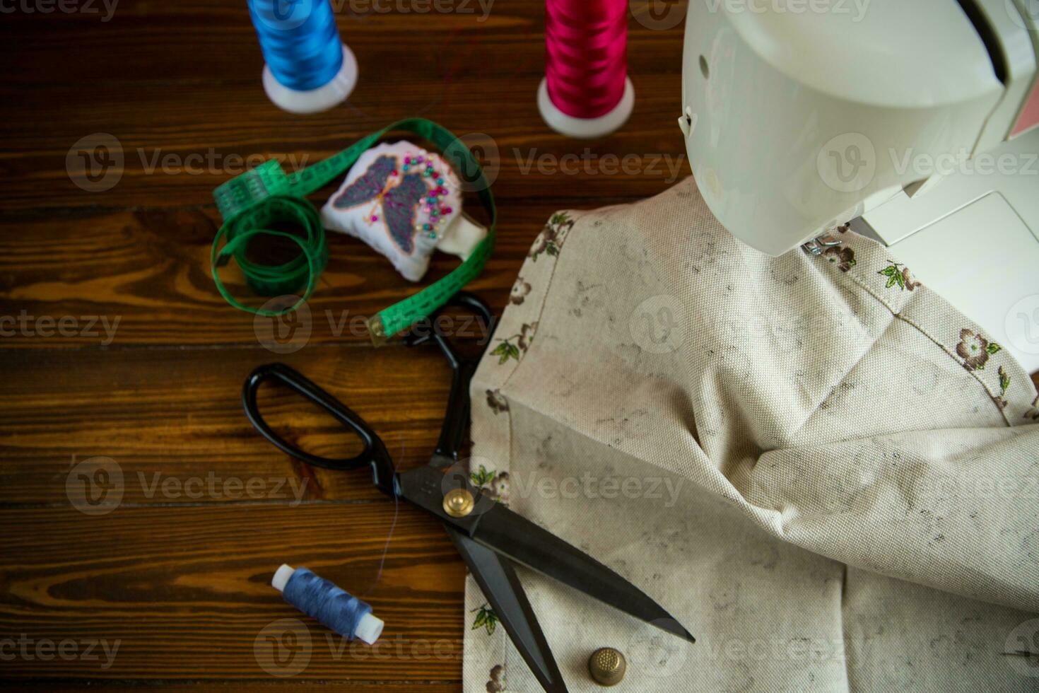 a set of tools and threads for sewing clothes photo