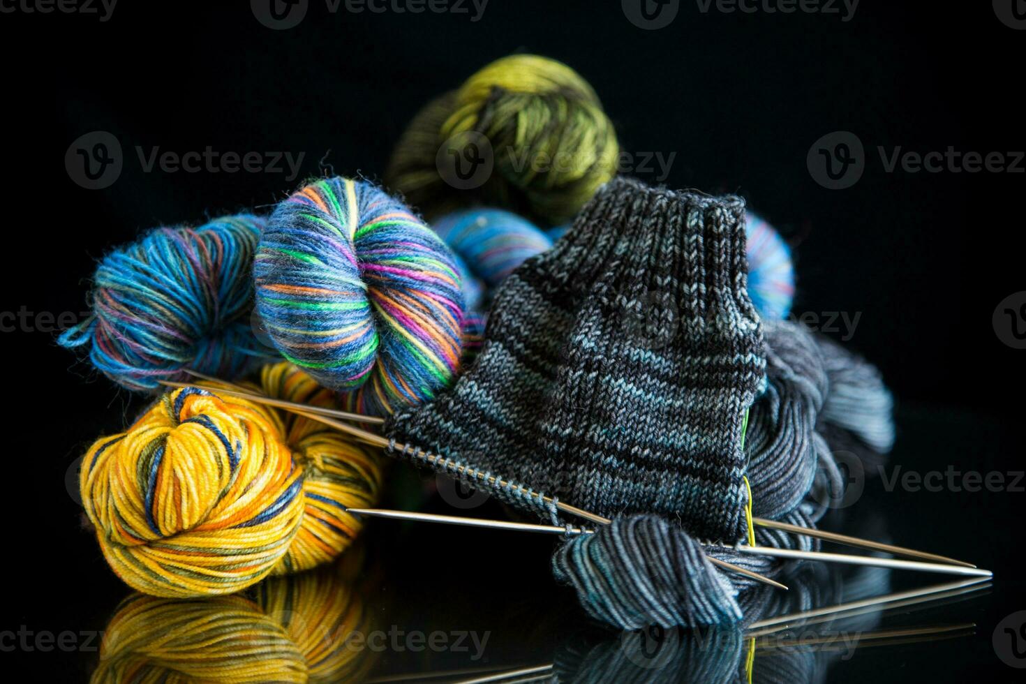 Colored threads, knitting needles and other items for hand knitting photo