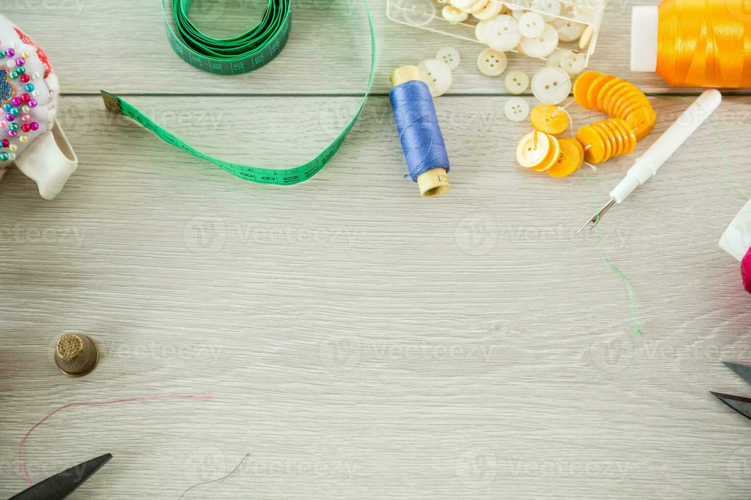 a set of tools and threads for sewing clothes photo