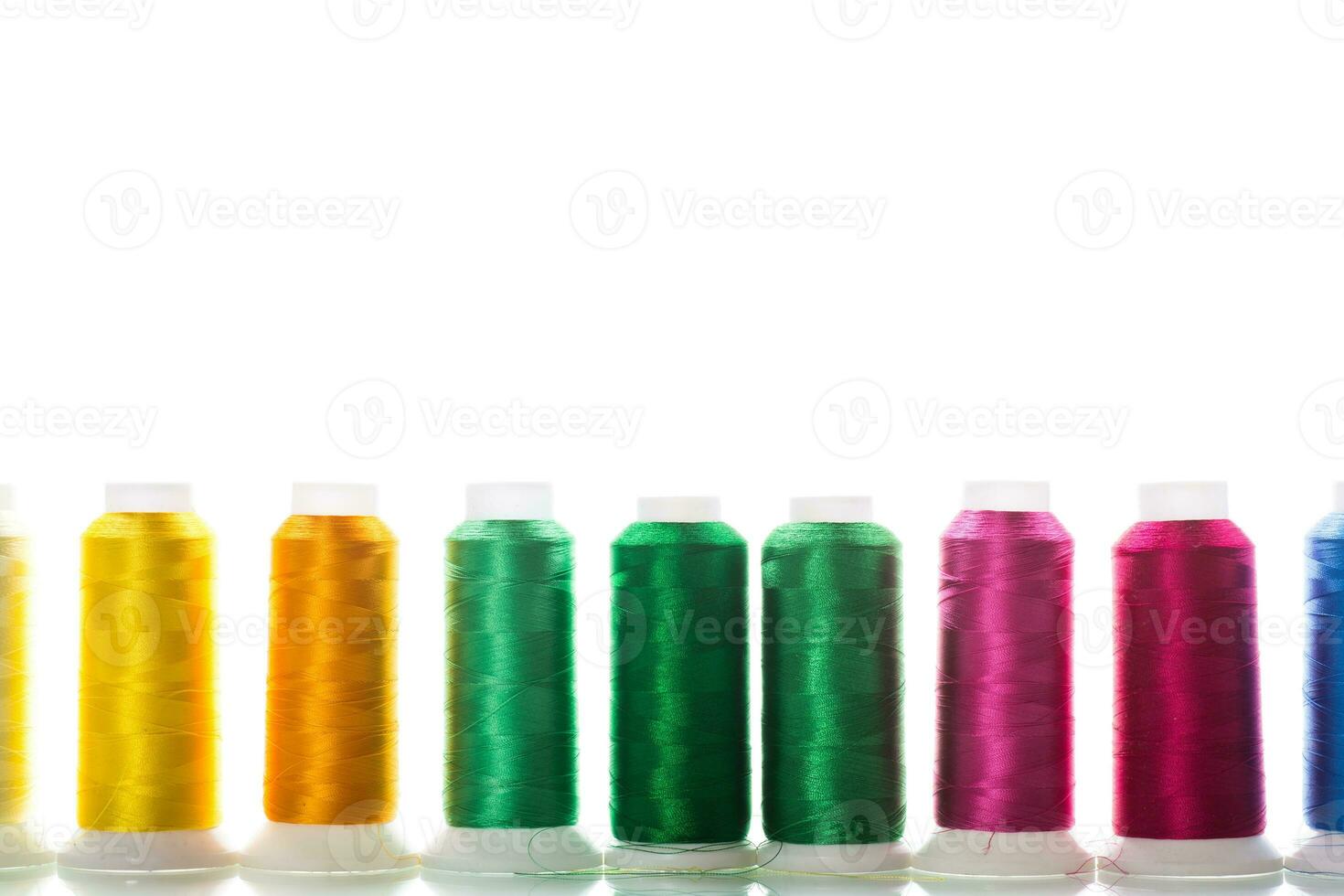 set of different color sewing threads,on white background. photo