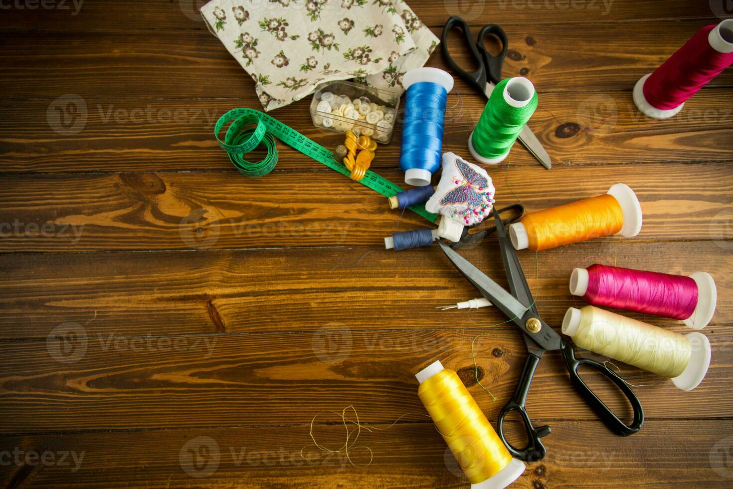a set of tools and threads for sewing clothes photo