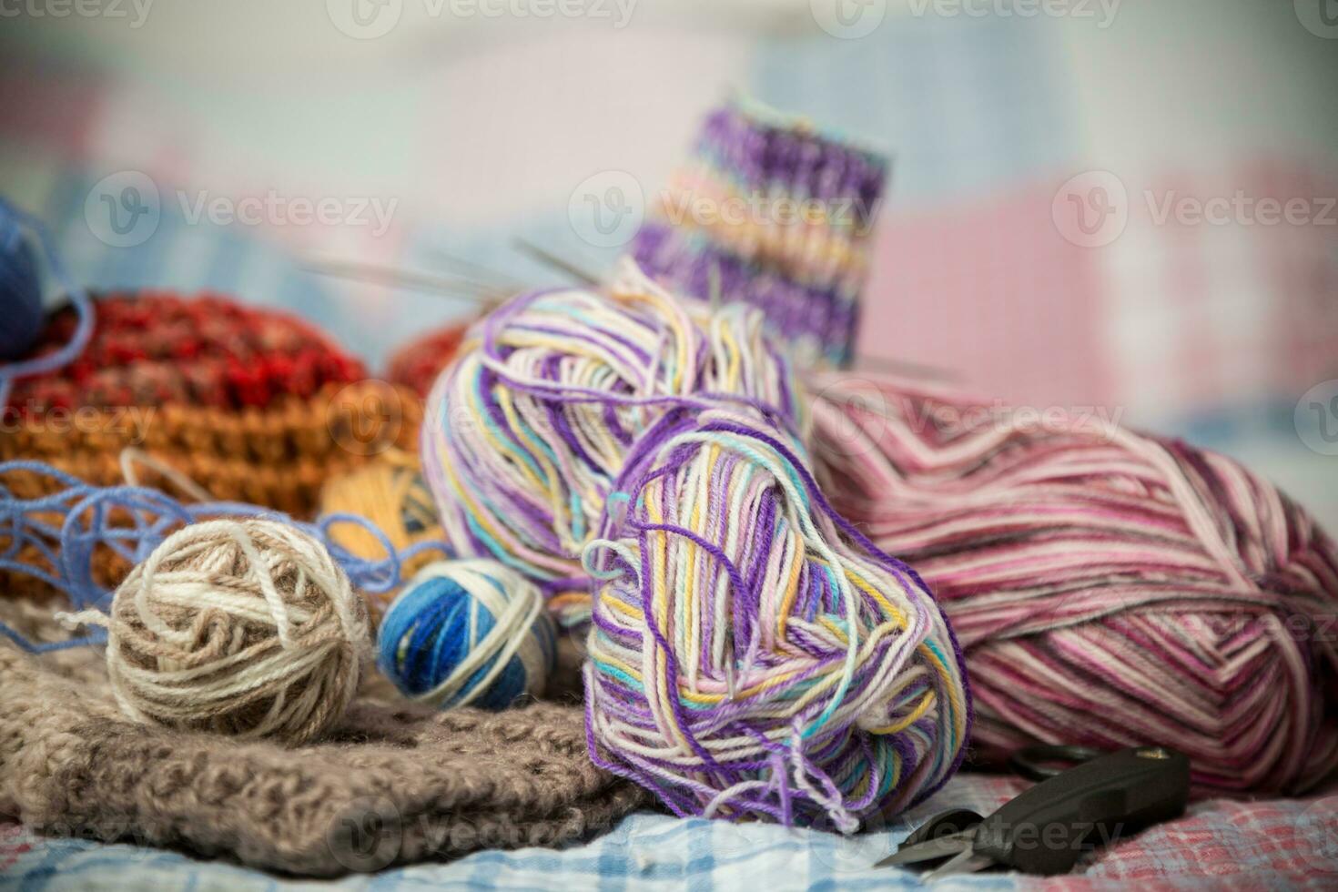 Colored threads, knitting needles and other items for hand knitting photo