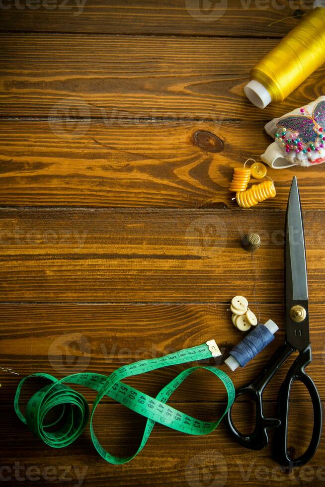 a set of tools and threads for sewing clothes photo