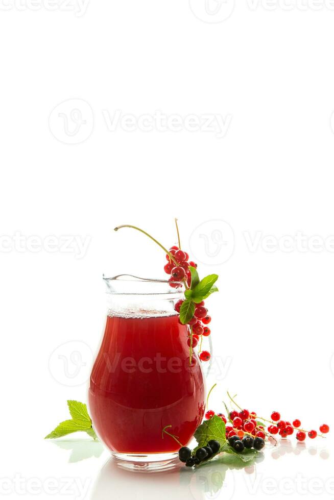 fresh berry juice from red and black currant, on white background photo