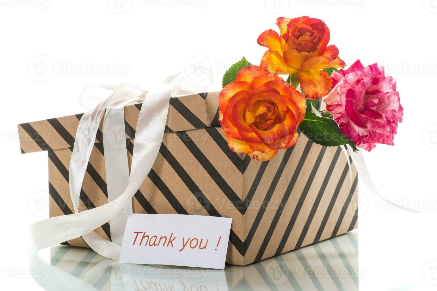 gift box with ribbons and beautiful roses inside. photo