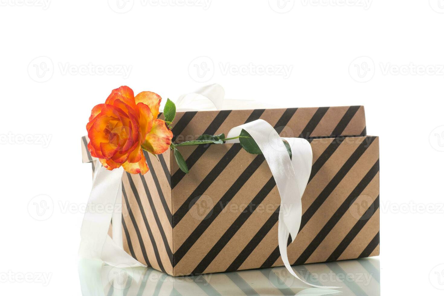 gift box with ribbons and beautiful roses inside. photo