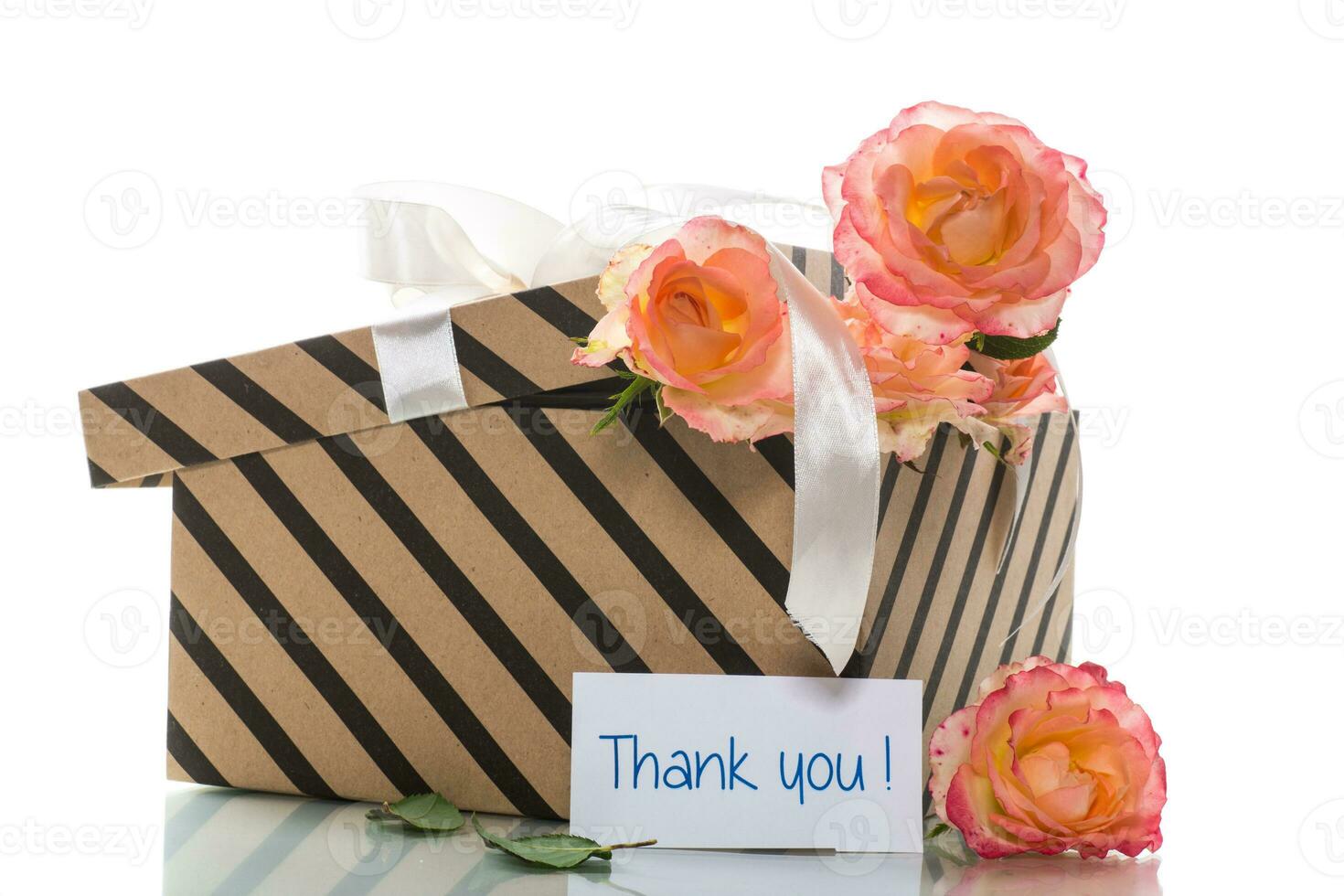 gift box with ribbons and beautiful roses inside. photo