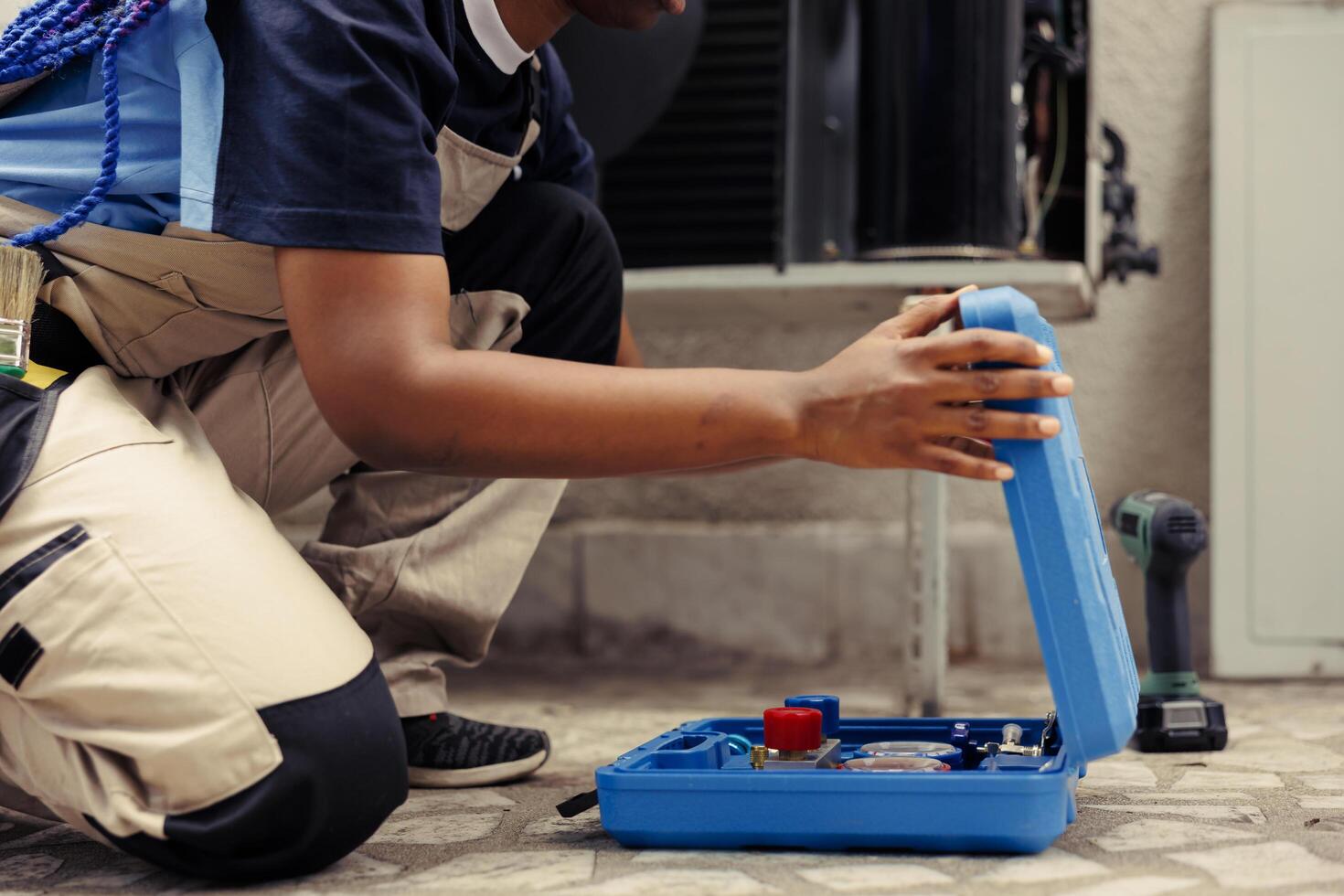 Worker unpacking professional toolbox photo