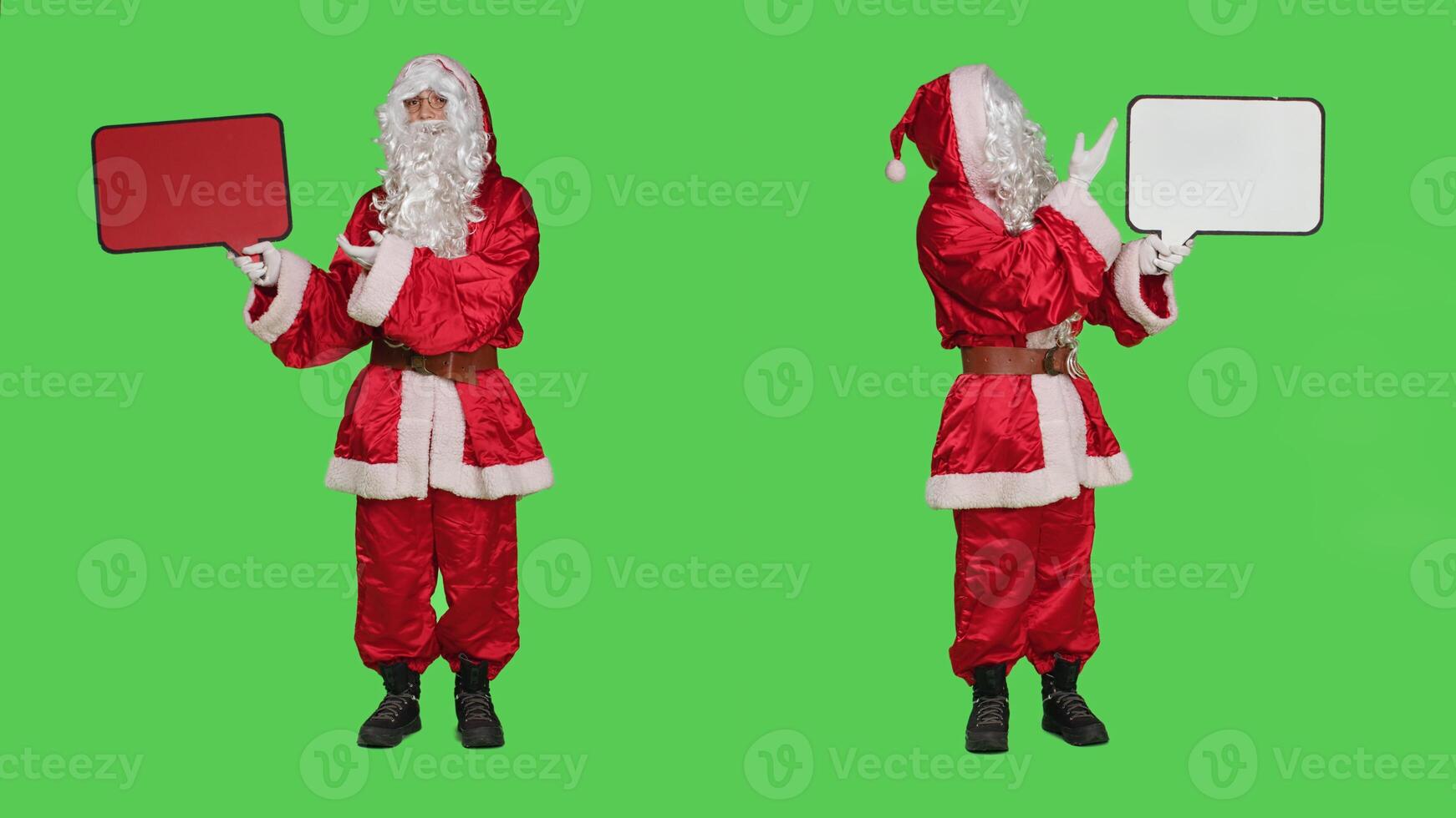 Saint nick holding speech bubble red billboard while he wears festive traditional costume and hat. Santa embodiment showing cardboard icon for advertisement, full body greenscreen. photo