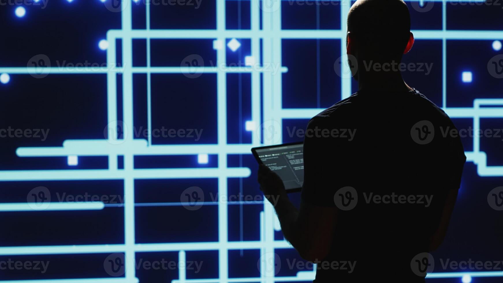 Man engineer verifying big data AI brain used for deep learning and machine learning, artificial intelligence development. Modern cyber security research on tablet, system engineering. Handheld shot. photo