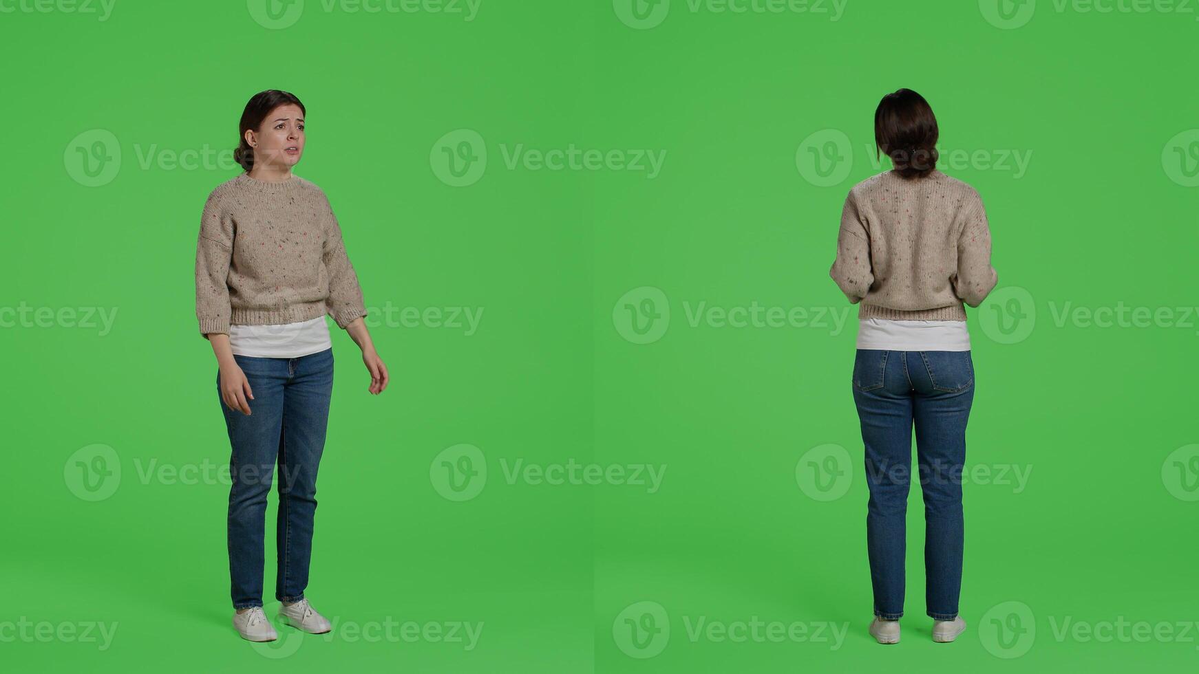 Furious negative adult standing on full body greenscreen, showing disappointment and disapproval over green screen backdrop. Frustrated upset model being angry and displeased in studio. photo