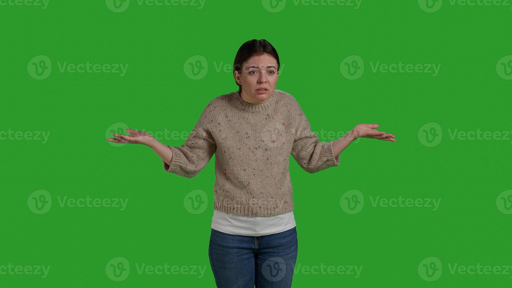 Front view of mad woman being upset on isolated backdrop, acting furious and displeased in studio. Young person in conflict showing disagreement and disapproval, negative emotions. Close up. photo