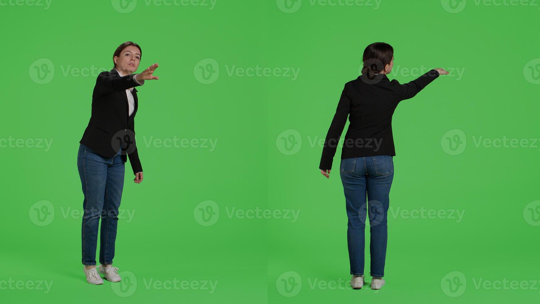 Office accountant advertising wave to call someone over, asking for person to come in studio. Female manager in suit raising hand standing over full body isolated greenscreen background. photo