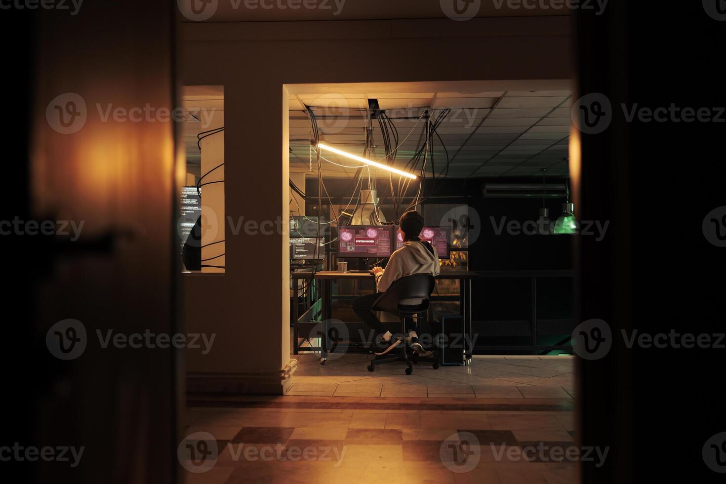 Male online criminal solving data leak problem, computer system hacking and database server cyberattack. Young professional spy cracking server encryption to steal passwords. Cybersecurity. photo