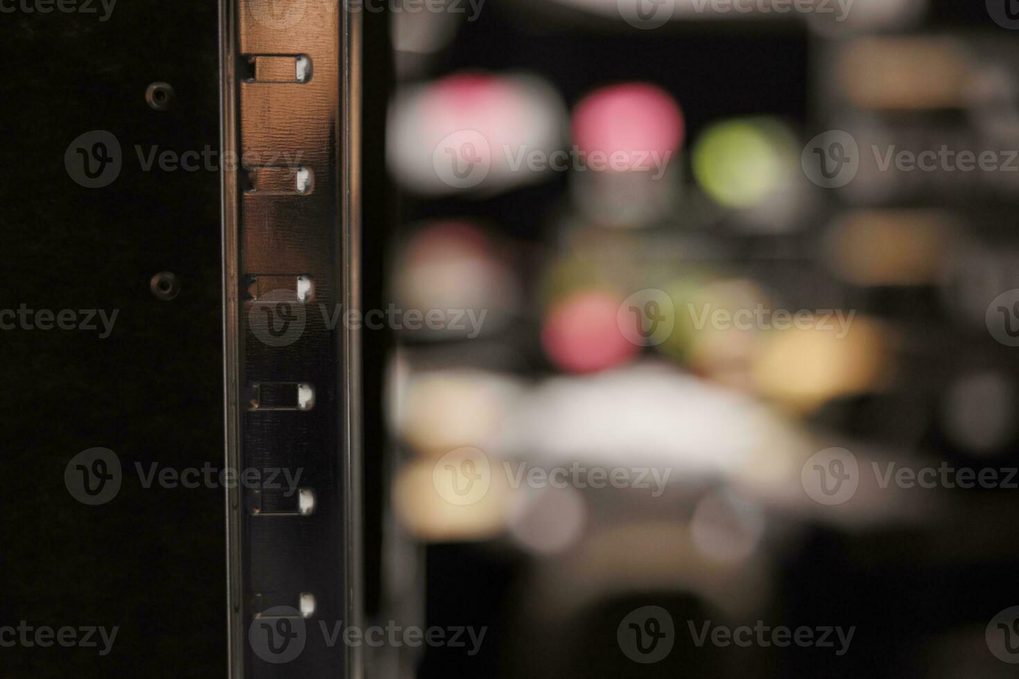 Metal shelf for folders with reports documentation in empty police investigator office. Rack for crime case files in blurred private detective agency close up selective focus photo