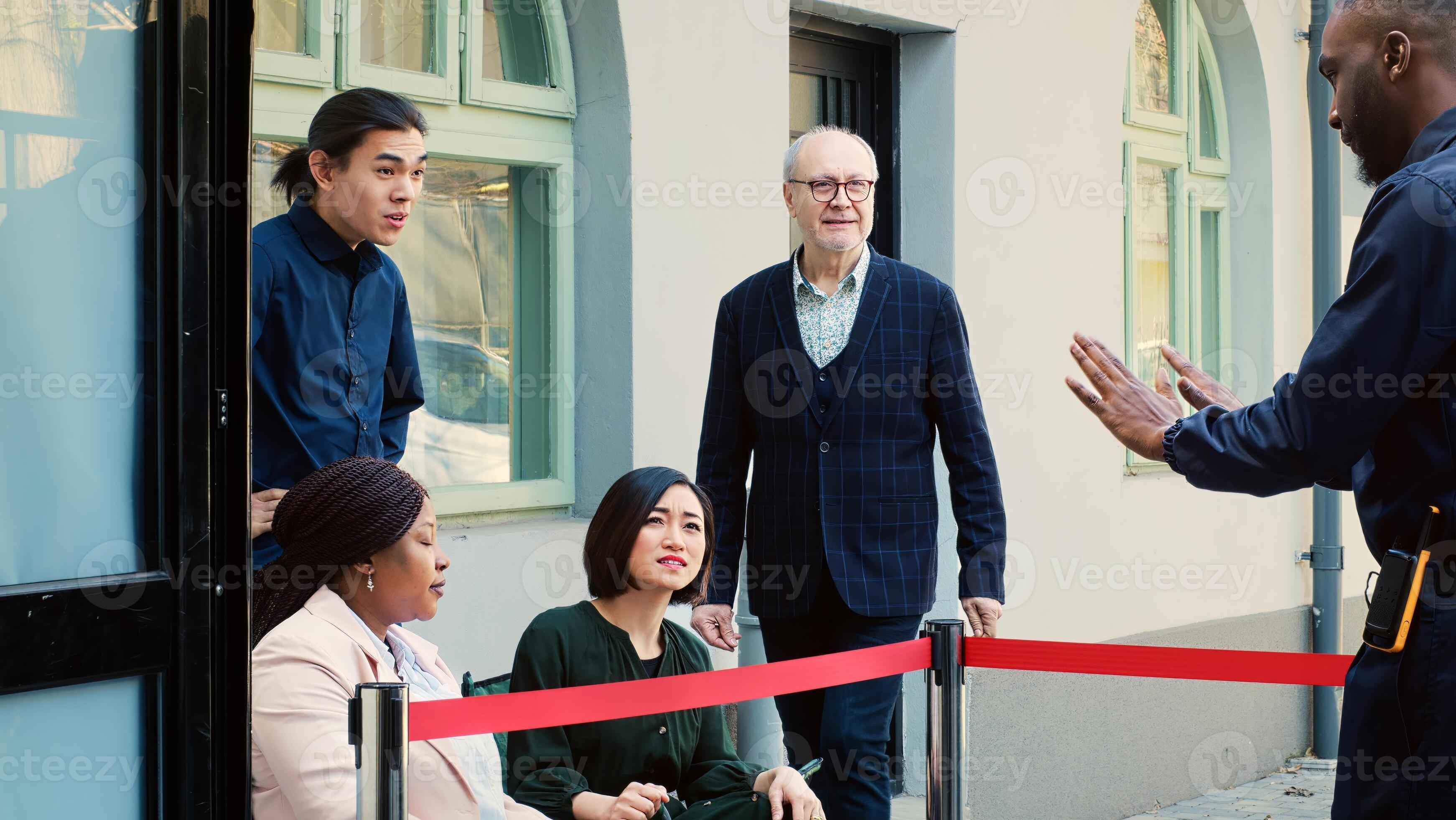 Crowd of people outdoors in line, gathering in the morning and wait to