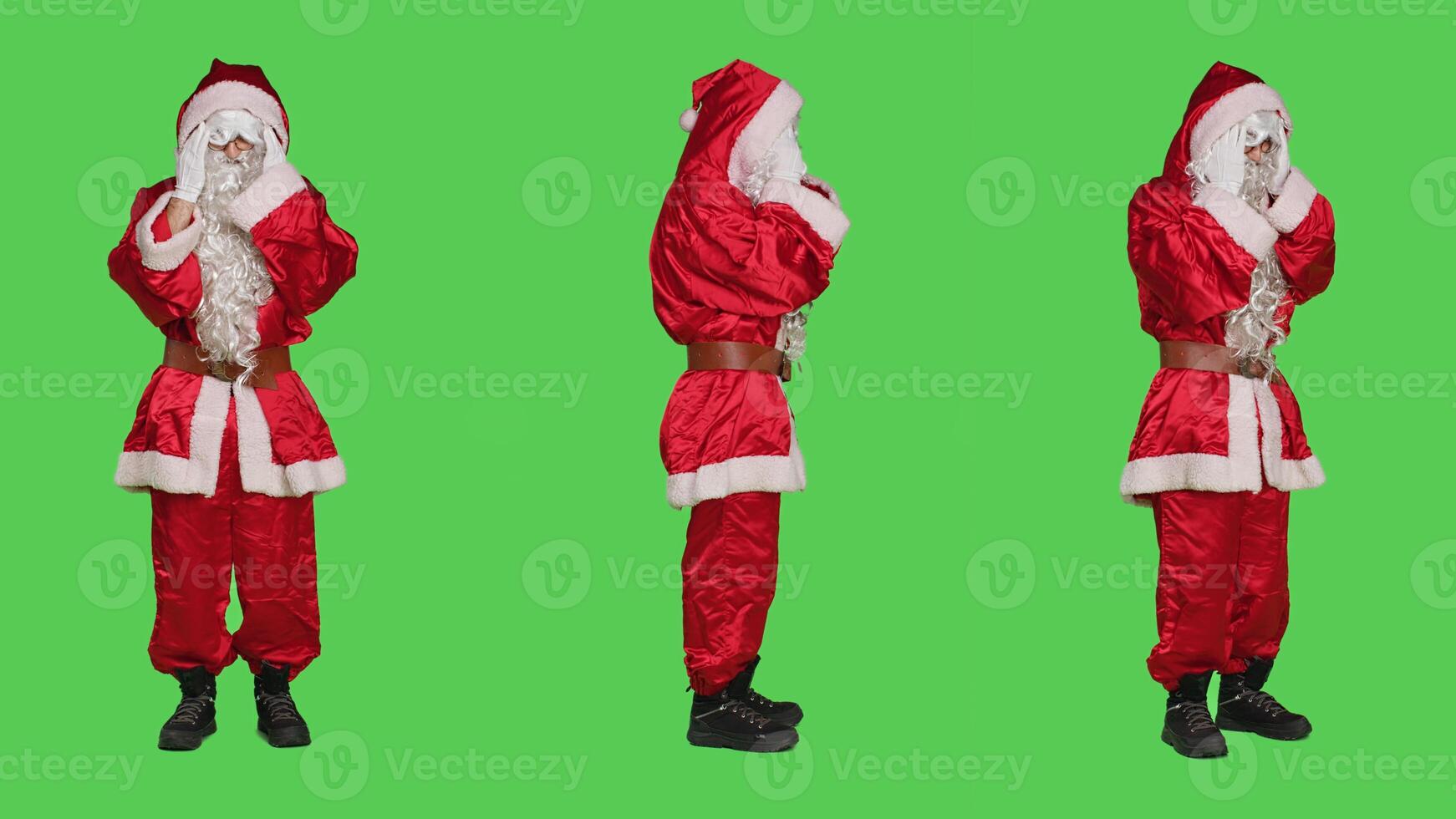 Father christmas unwell with headache feeling sick during winter holidays, wearing traditional costume on full body greenscreen. Santa claus suffering from migraine, being in pain on camera. photo