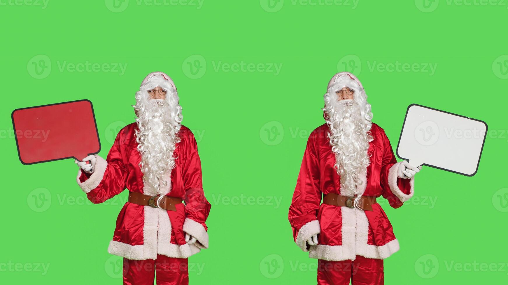 Father christmas using speech bubble on camera, doing seasonal winter advertisement with person dressed like santa claus. Cheerful man in red costume holding billoard with copyspace. photo