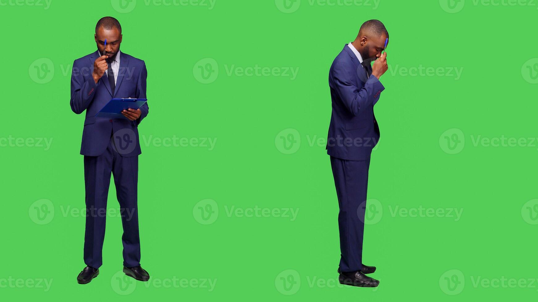 Businessman thinking about company information in studio, brainstorming new ideas and taking notes on clipboard papers. Young office employee wearing formal suit and being pensive. photo
