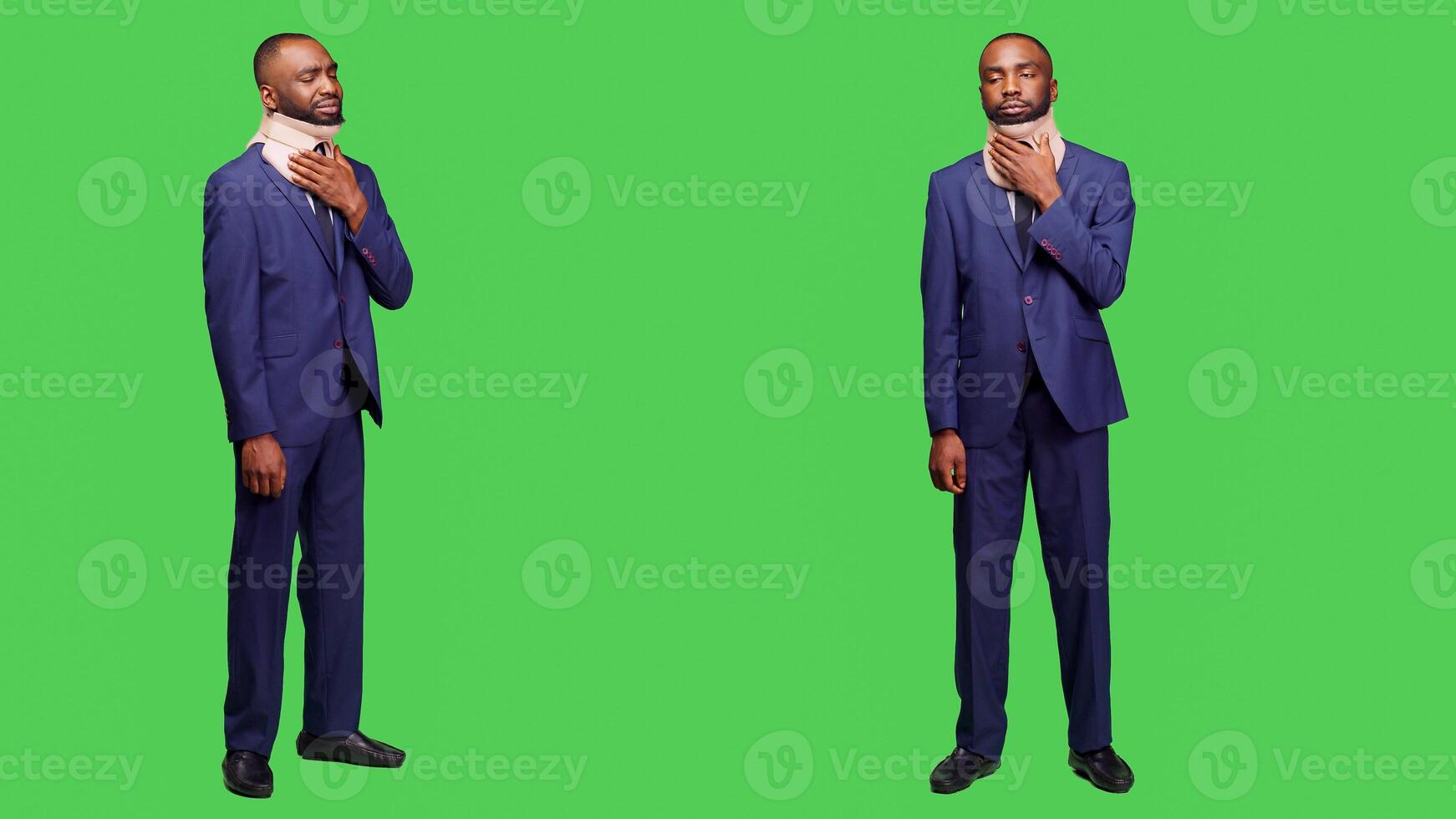 Injured businessman wearing suit and cervical neck collar standing over full body green screen. Young man employee being in pain after injury, medical brace for fracture in studio. photo