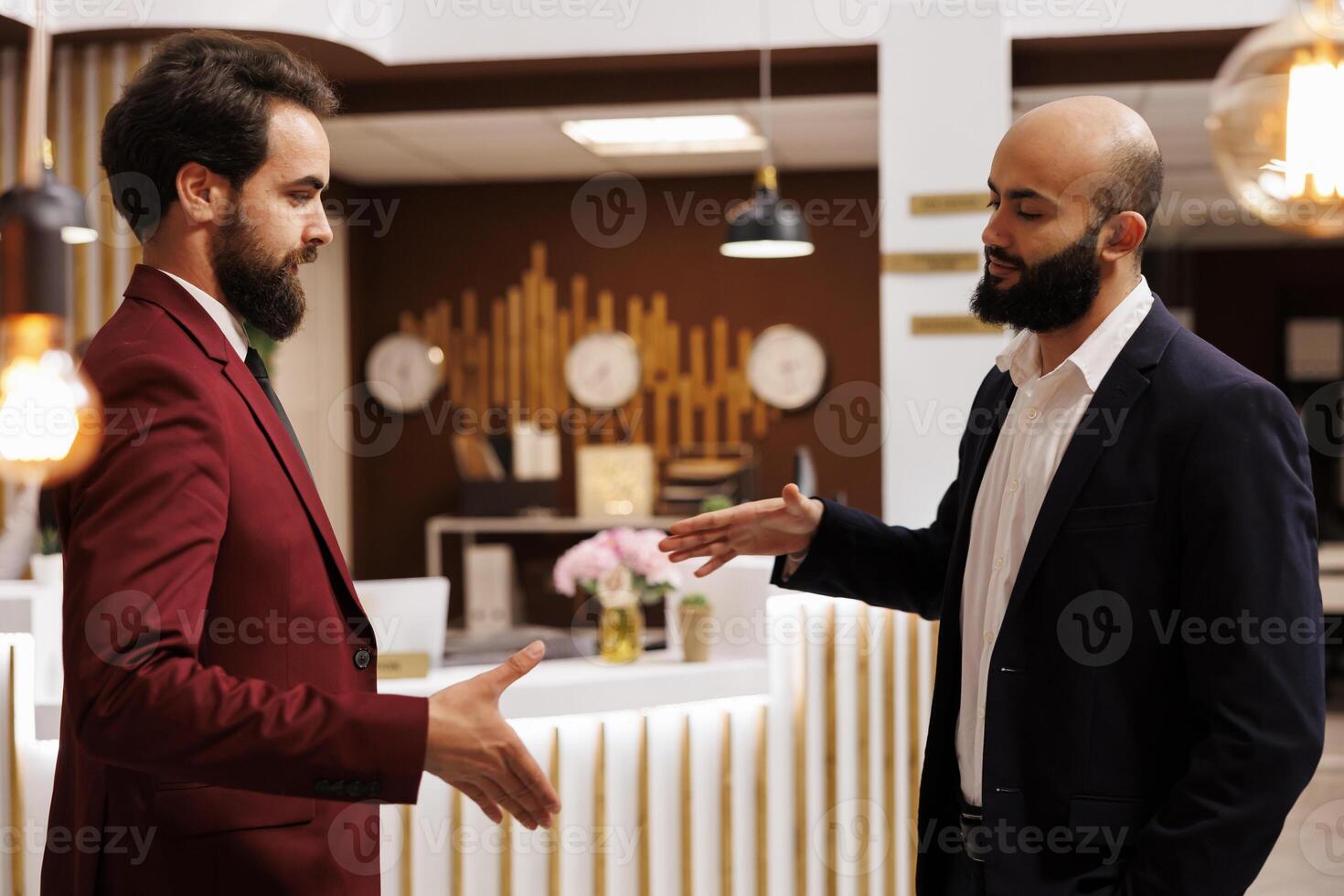 Professionals shake hands at meeting, creating new future partnership between corporations. Businessmen successfully collaborating on project at conference, handshake agreement. photo